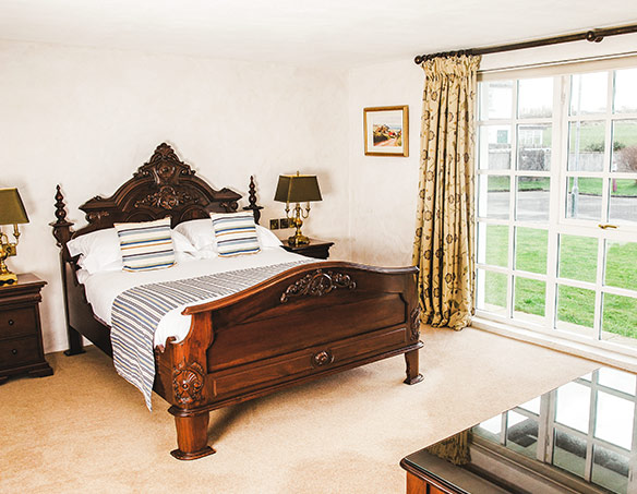 Bed in the Superior Guest Room at The Bushmills Inn